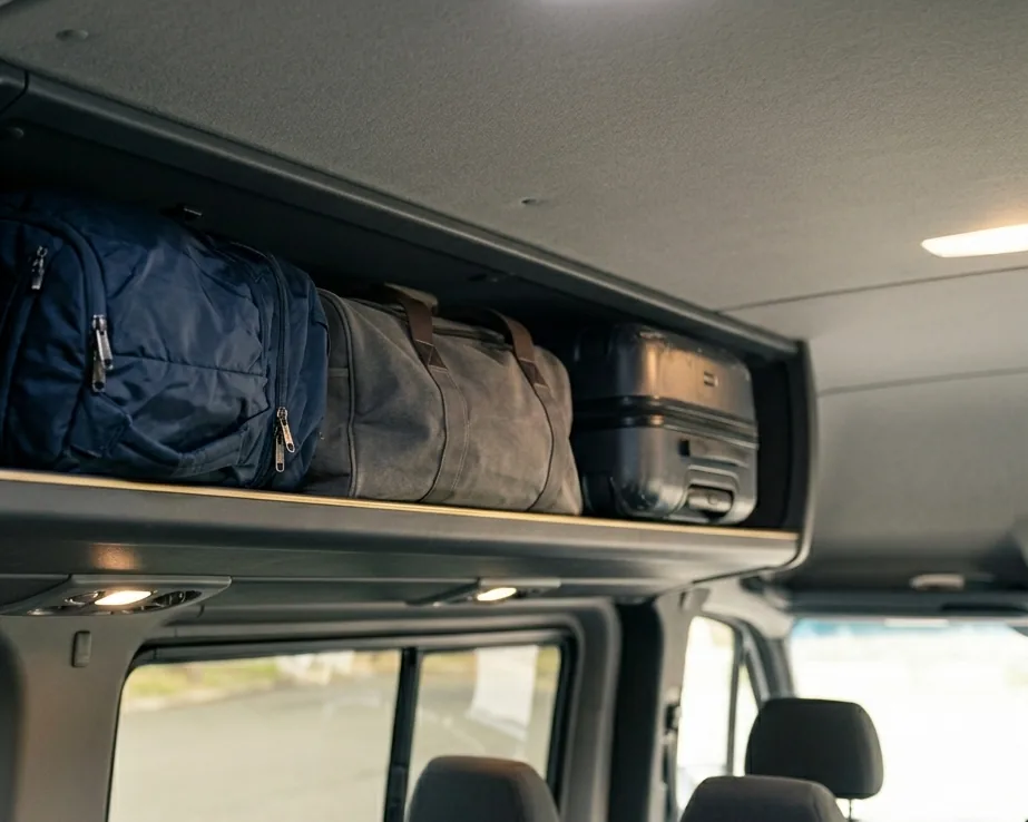 Mini Bus luggage compartment with suitcases loaded